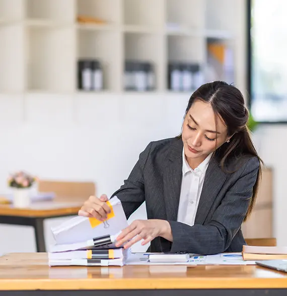 Tax professional reviewing tax-related records representing Tax, Accounting and Bookkeeping Services in Missoula, Montana